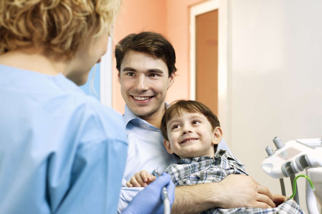 When should my child first visit the dentist?